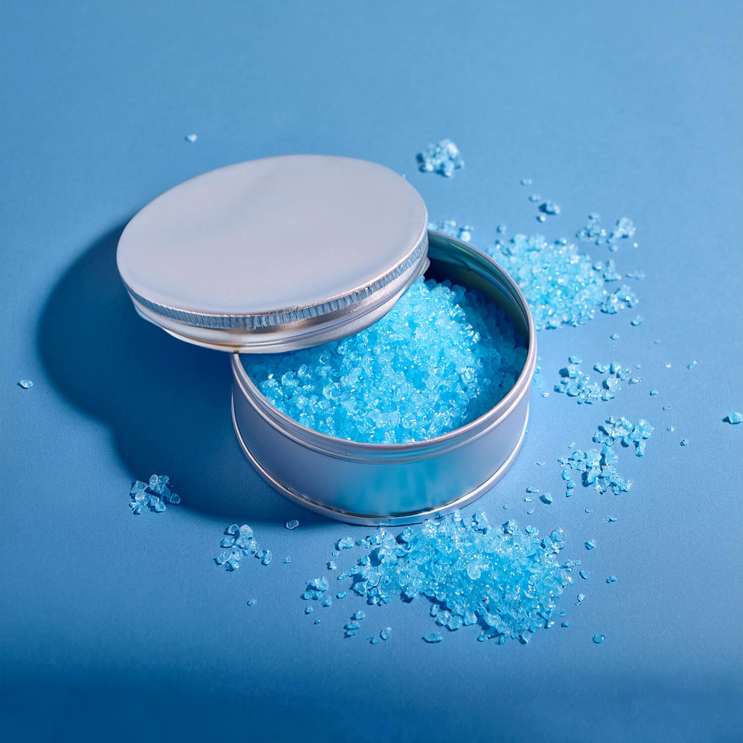 Blue foaming shower scrub in aluminium container